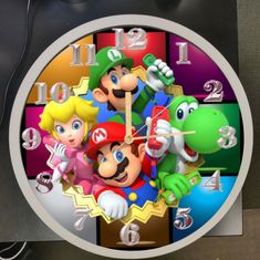 a clock with mario bros characters on it's face and numbers in different colors