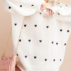 SWEATER WEATHER 🖤 HEARTS Warm ivory knit sweater with black heart detail Ribbed trim, cuffs, & hem Oversized, relaxed fit Fits true to size 85% Acyrlic, 15% Polyester Available in standard & plus sizing Measurements approximately: Small: Bust 48", Waist 30", Length 25" Medium: Bust 52", Waist 32", Length 25.5" Large: Bust 56", Waist 34", Length 26" White Heart Sweater For Winter, White Heart-shaped Sweater For Spring, White Heart Print Sweater For Winter, Casual White Heart Print Sweater, White Casual Sweater With Heart Print, Oversized Heart-shaped Sweater For Winter, Casual White Sweater With Heart Print, Oversized Heart Print Sweater For Fall, White Trendy Sweater With Heart Print