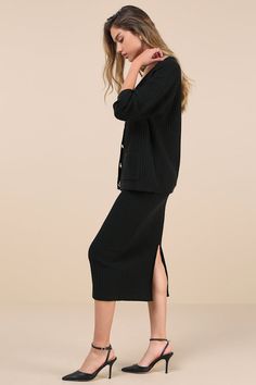 You'll be ready for a season of chic 'fits with the Lulus Toasty Sophistication Black Two-Piece Cardi Sweater Midi Dress! Midweight fabric, with a waffle knit-inspired texture, shapes a relaxed-fit cardigan top with long sleeves, drop shoulders, and a V-neckline. Functional button placket (with embossed gold buttons) accents the front, alongside two patch pockets. Matching skirt has a high, elasticized waistband and a figure-skimming silhouette that ends at a midi hem with a back kick pleat. Rib Elegant Fitted Midi Dress For Loungewear, Chic Fall Midi Dress For Loungewear, Elegant Winter Loungewear Midi Dress, Elegant Winter Midi Dress For Loungewear, Elegant Midi Dress For Loungewear, Elegant Midi Length Loungewear Dress, Elegant Midi Length Lounge Dress, Midi Dress Cardigan, Season Of Chic