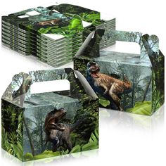 four boxes with dinosaurs on them in the jungle