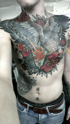 a man with an owl tattoo on his chest