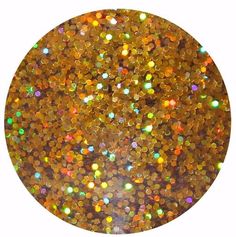 an orange and gold colored glitter in a circle