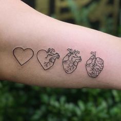 four heart shaped tattoos on the arm