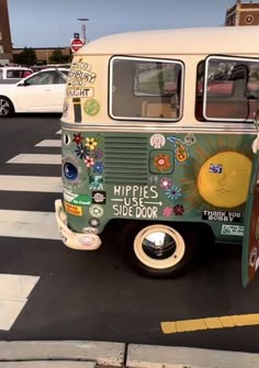 a green and white bus is parked on the street