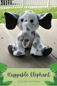 an elephant stuffed animal sitting on the ground