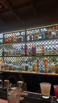 the bar is full of liquor bottles and glasses