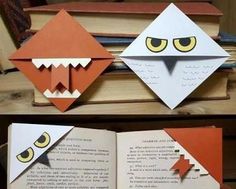 an open book with paper cut out of it's face and eyes on top