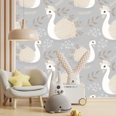 a baby's room with an animal themed wallpaper