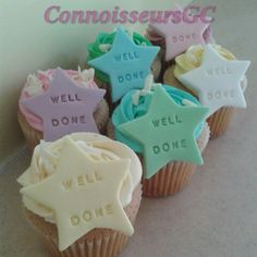 some cupcakes that are decorated with fondant stars and words on top of them