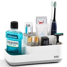 the toothbrush holder is organized with various items such as mouthwashes, and other personal care products