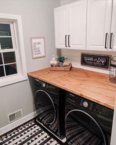 a washer and dryer in a small room