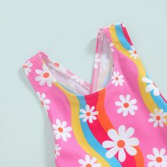 The SUNNY DAYS Bowtie Swimsuit is the perfect choice for your baby girl's summer adventures. Its cute and lively design features a lovely floral print and a charming bowtie, making her stand out at the pool or beach. Get her ready for some fun in the sun with this adorable swimsuit. Cute Swimwear For Spring Playwear, Cute Printed Swimwear For Spring, Pink Swimwear For Summer Playtime, Floral Print Swimwear For Spring Playwear, Cute Pink Spring Swimwear, Fun Sleeveless Swimwear For Spring, Cute Multicolor Sleeveless Swimwear, Summer Outfit Accessories, Boy Onesie