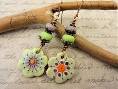 Asymmetrical Bohemian Earrings in Lavender Lime Green and Orange, Colorful Earrings, Gift for Her Green Bohemian Earrings With Unique Variations, Bohemian Nickel-free Earrings For Spring, Green Bohemian Jewelry For Spring, Bohemian Jewelry With Ear Wire For Spring, Green Bohemian Flower Earrings For Gift, Bohemian Lavender Drop Earrings, Spring Bohemian Purple Jewelry, Ceramic Earrings, Asymmetrical Earrings