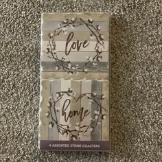 two coasters with the words love on them