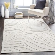 a white rug with wavy lines on it