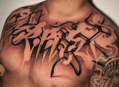 a man with tattoos on his chest is looking at the camera and has words written all over it