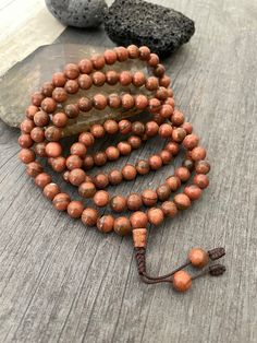 Unique and powerful Goldstone Japa mala Necklace from Nepal. A unisex piece that will be perfect for your day by day outfits and will be easy to match any other accessories. If it fits right can be a bracelet also. This is also a Buddhist praying 108 beads mala. The japa mala is 42.5cm- 16.75 inch long A unique addition to your jewelry collection. Enjoy Con salud Spiritual Beaded Bracelets For Rituals, Spiritual Gemstone Beads For Rituals, Spiritual Wooden Beaded Healing Bracelets, Spiritual Round Beaded Bracelets For Meditation, Spiritual Beaded Bracelets For Meditation, Bohemian Round Beads For Meditation, Holistic Beaded Bracelets With Round Beads For Meditation, Spiritual Polished Brown Beads, Spiritual Brown Polished Beads