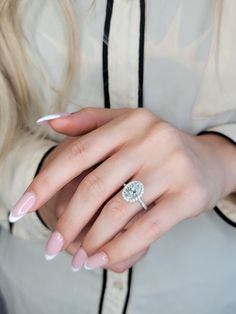 a woman's hand with a ring on it