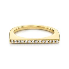 a yellow gold wedding band with diamonds on the sides and a thin bar in the middle