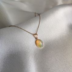 ITEM DESCRIPTION: >> The Pendant is made from Solid 14K Yellow Gold. Gemstone used is absolutely natural and ethically sourced. >> Natural Ethiopian Opal in cabochon oval shape with bezel setting is studded on it with utmost precision.  >> This is a minimalist design and is absolutely hassle-free and everyday jewelry.  Gem: Opal Gem size: 9x11 mm Gem weight: 2.68 carats Gold purity: 14K (58.33% approx.) Gold weight: 0.43 grams  Gross weight: 0.97 grams The Gold purity is guaranteed and it comes with authentic 14K gold hallmark. Since this Pendant is handmade, It is Nickel/Lead FREE.  CUSTOMIZATION: --> Pendant can be made in thicker bezel as well. --> You can choose your own gemstone option. --> Kindly drop a message for the same. CUSTOMER SUPPORT: --> We are available 24/7 to respond to a 14k Gold Birthstone Jewelry For Celebration, Oval Gemstone Necklaces For Celebration, Yellow Gold Opal Oval Necklace, Oval Opal Necklace In Yellow Gold, Yellow Gold Oval Opal Necklace, Oval Yellow Gold Opal Necklace, Oval Yellow Gold Jewelry For Celebrations, Oval Opal Necklace For Anniversary, Gold Oval Birthstone Necklace