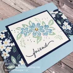 a card with flowers on it and the word friend written in cursive writing