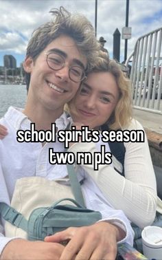 a man and woman sitting next to each other with the words school spirit's season two