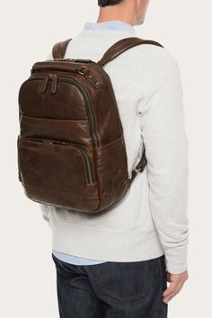 Hand-burnished and bench-crafted, the Logan Backpack's pull up leather is treated to enhance the highs and lows. Full of pockets and complete with padded straps, this backpack pulls its weight on trips and commutes. Factory-forged hardware lends a handsome finish. 17" height 11 1/2" width 35 1/2" strap drop Two adjustable shoulder straps Leather Backpack For Men, The Frye Company, Cute Wallets, Mens Leather Bag, Navy Fashion, Men Fashion Casual Outfits, Cute Bags, Pull Up, Leather Care