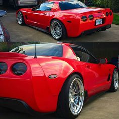 the red sports car is parked on the side of the road in front of other cars