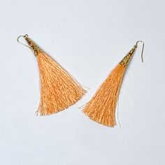 Gold Tone Filigree Cap Drop Tassel Earrings in Coral Orange - Giddy Up Glamour Boutique Trendy Adjustable Tassel Earrings, Orange Tassel Dangle Earrings, Summer Tassel Dangle Earrings With Latkans, Summer Tassel Dangle Earrings, Orange Fringe Tassel Earrings For Summer, Summer Latkans Tassel Dangle Earrings, Bohemian Orange Tassel Earrings For Party, Summer Latkan Tassel Dangle Earrings, Orange Fringe Dangle Earrings