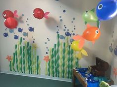 the room is decorated with fish and balloons