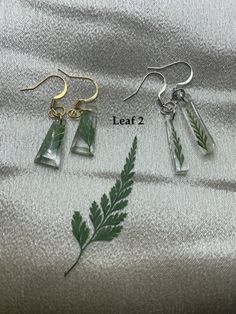 Pressed flowers drop earrings, gifts for mom, aunt, friend, grandma, sister, gardener, green thumbs, or for yourself. The earrings come with nickel free silver plated or 18K gold plated earwires. HOW TO ORDER: - Choose Earwire Material - Choose Shape and Leaf Style. (refer to the photo with labels) Ordering as a gift? Please choose the gift option at checkout. Please enter your message to the recipient if you wish and it will be inserted in a lovely envelope. Gift wrap for only $4.00. The gift o Silver Pressed Flowers Earrings For Gift, Silver Flower Earrings With Pressed Flowers, Green Pressed Flowers Earrings For Gift, Silver Pressed Flower Earrings, Nature-inspired Dangle Earrings With Pressed Flowers, Cute Envelopes, Sweet Lady, Flower Stamp, Real Flowers