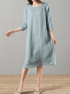 "This slightly A-shaped linen dress is a perfect example of elegance in simplicity. Soft linen fabric, right at knee length, side pockets for convenience, rimmed collar and sleeves in contrast color fabric, all work together for an elegant yet comfy look. - Handmade with 100% medium weight linen - Scoop neck with rimmed collar - Rimmed 3/4 sleeves - Knee Length - Color in listing: Burgundy, Cloudy Sky Please provide your shoulder width, full bust measurement ( measured around the fullest part ), Normal Dress Simple, Knee-length Unlined Linen Dress For Summer, Knee-length Unlined Linen Summer Dress, Spring Solid Color Knee-length Linen Dress, Knee-length Linen Dress In Solid Color, Relaxed Fit Blue Linen Knee-length Dress, Linen Camisole, Linen Slip Dress, Linen Midi Dress