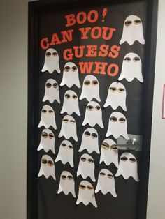 a door decorated with ghost faces and words that say boo can you guess who?