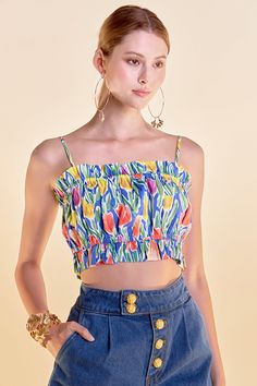 Add a touch of romance to your wardrobe with our Floral Print Ruffled Cropped Top. Featuring a flirty crop design and delicate spaghetti straps, this top is perfect for warm weather days. The playful ruffled details add a fun and feminine touch, while the lining ensures a comfortable fit. The bold floral print will make a statement wherever you go. Don't miss out on this must-have top for the season. Cropped Spaghetti straps Ruffled Lined Hand wash cold Do not bleach Do not tumble dry Iron low Exclusive of Elastic Shell:100%Cotton Lining: 80% Polyester 20% Cotton AY446T Total length: 15.75" Bust: 28.5" Summer Camisole With Built-in Bra And Ruffled Straps, Feminine Spring Crop Top With Built-in Bra, Camisole Crop Top With Built-in Bra For Vacation, Summer Multicolor Crop Top With Built-in Bra, Spring Beach Tops With Built-in Bra, Flirty Crop Top With Built-in Bra For Spring, Summer Floral Print Cropped Crop Top, Summer Floral Print Cropped Top, Summer Tops With Ruffled Straps For Spring