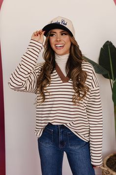 Get ready to up your style game with THE JODIE STRIPED TOP. The long sleeve, polo style shirt features a chic brown and neutral stripe pattern, adding a touch of uniqueness to your outfit. Dress it up or down, this top is versatile and sure to become a staple in your wardrobe. Paired with THE CONNER RIBBED TURTLENECK IN TAUPE , THE PAYSEN PANTS IN DARK DENIM & THE GAMEDAY CLUB TWO TONE BASEBALL CAP Long sleeve Polo neckline Brown detailing V-neck 50% cotton, 39% polyester, 11% spandex Runs true Outfit Dress, Ribbed Turtleneck, Polo Style, Style Shirt, Long Sleeve Polo, Dark Denim, Stripes Pattern, Baseball Cap, Shirt Style