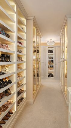 a walk in closet filled with lots of shoes