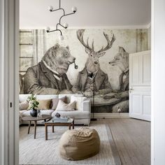 a living room filled with furniture and a mural on the wall behind it's doors