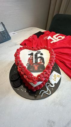 a heart shaped cake sitting on top of a table