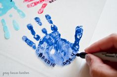 a hand print is being drawn on a piece of paper