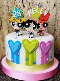 the powerpuff girls birthday cake is decorated with fondant decorations