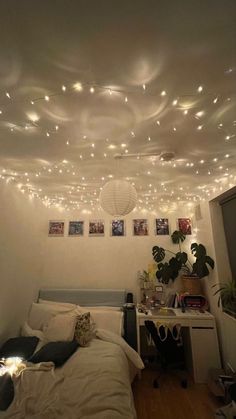 a bedroom with lights hanging from the ceiling