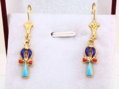 Colored Ankh Cross 18K gold Earrings | Egyptian Earring Key of Life Stamped Gold Pharaonic ankh earrings Egyptian cross Earrings gift 2.7Gr Weight approximate : 2.7 Gr ✔ IT IS Tested & SIGNED WITH THE EGYPTIAN Gold Government HALLMARK FOR 18K GOLD to Ensure      Authenticity. ✔ Lovely gift idea ABSOLUTELY GORGEOUS, LOOKS FABULOUS ON. ✔ 100% Egyptian handmade. ✔ Condition: A brand-new, exactly as on the photos. ★ GIFTS ✔ All items are packaged in a paper jewelry gift box, ready for gifting. ✔ If you are sending a gift directly to the recipient, don't worry about there being a receipt in the package. Since order receipts are emailed directly to you, we don't include one when we ship items. ★ PROCESS TIME ✔ Currently Processing Time 2-5 days, excluding holidays. This is approximately business Ankh-shaped Earrings For Pierced Ears As Gift, Ankh Earrings, Egyptian Earrings, Egyptian Cross, Egyptian Gold, Key Of Life, Ankh Cross, 18k Gold Earrings, Gold Jewelry Earrings