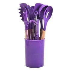 purple kitchen utensils in a cup on a white background