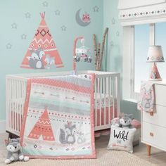 a baby's nursery room decorated in pink and gray