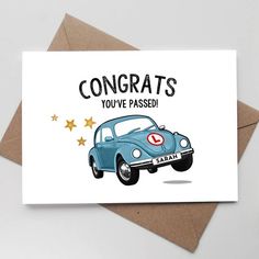 a card with an image of a blue car and stars on the front, says congrats you've passed