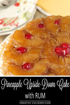 a pineapple upside down cake on a plate with rum in the background and text overlay that reads, pineapple upside down cake with rum