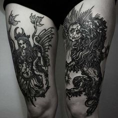 a woman's leg with tattoos on it and a lion in the middle of her legs