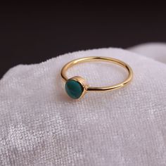 "Materials Gold, Rose gold, White gold Gemstone: turquoise Turquoise Ring / Round Cut Turquoise Ring In 14k Gold / Stackable Turquoise Ring / Natural Turquoise / December Birthstone Ring / Fine Ring Item Features * Made to Order. * Gold KT: 14K * Custom Gold Color: Rose Gold, Yellow Gold, White Gold * Gemstone Cut: Round * Number of Stones: 1 * Stone Size: 4 mm * Setting Type: Bezel * Band Width: 1.25mm * Ring is marked gold Marked * ready to Ship in 7-10 Business Days * Also available in other December Birthstone Ring, Minimal Ring, Fine Ring, Peridot Ring, Solid Gold Rings, December Birthstone, 14k Gold Ring, Moonstone Ring, Natural Turquoise