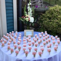 a table topped with lots of cards and flowers