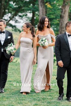 the bride and groom are walking with their friends